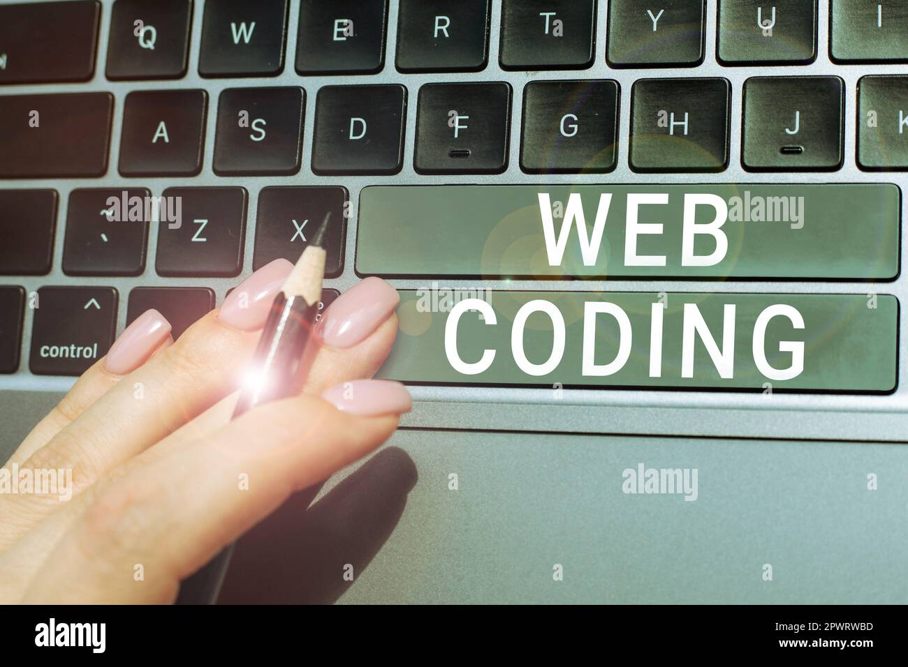 Writing displaying text Web Coding, Internet Concept work involved in developing a web site for the Internet Stock Photo