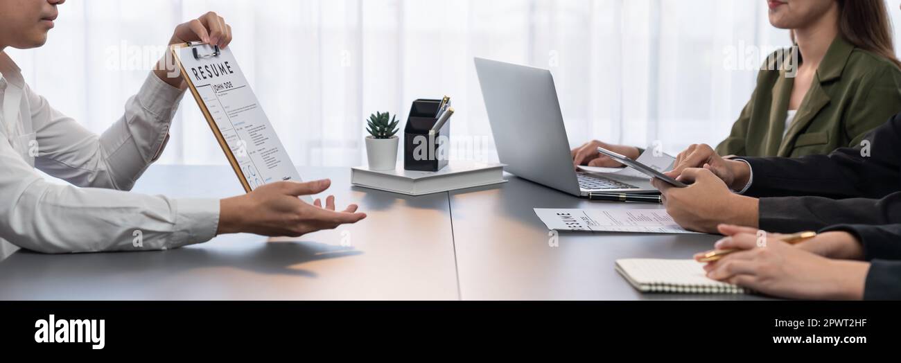 Candidate and interviewers discuss work experience and qualifications