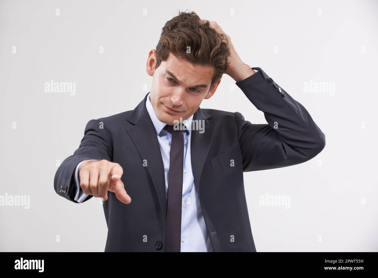 Human Getting Confuse Getting in touch with technology. a young businessman looking confused ...