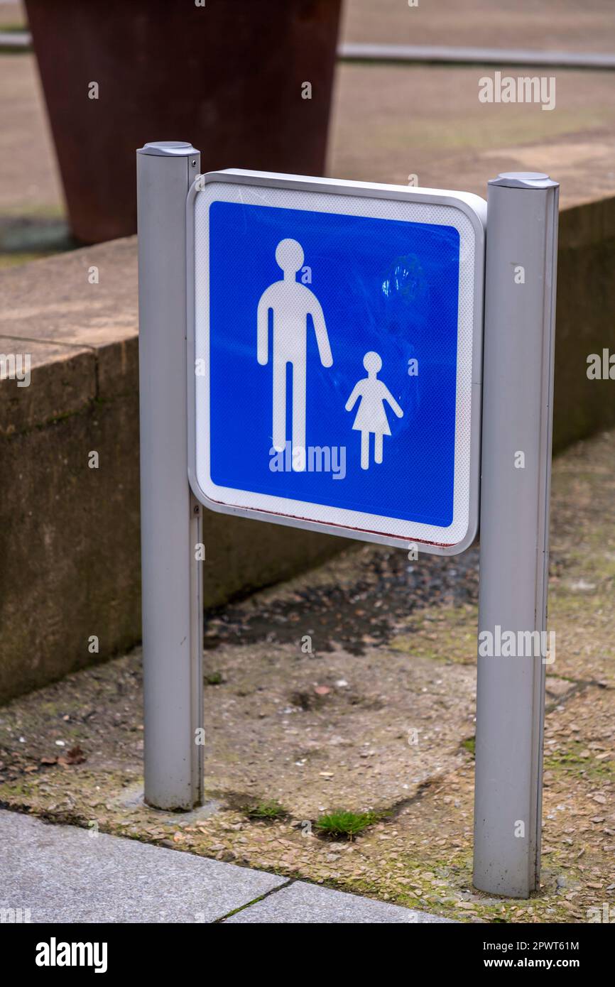 Child and parent pedestrian walking zone signage. Blue and white traffic sign Stock Photo