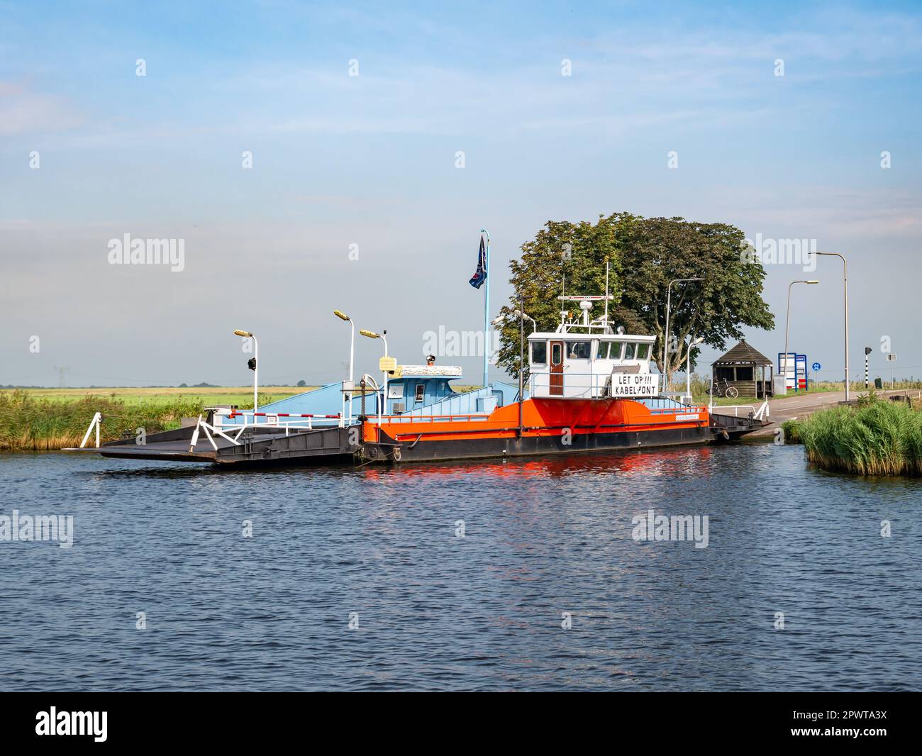 Motorised cable pontoon ferry boat between Zwartsluis and Genemuiden on Zwarte Water river, Overijssel, Netherlands Stock Photo