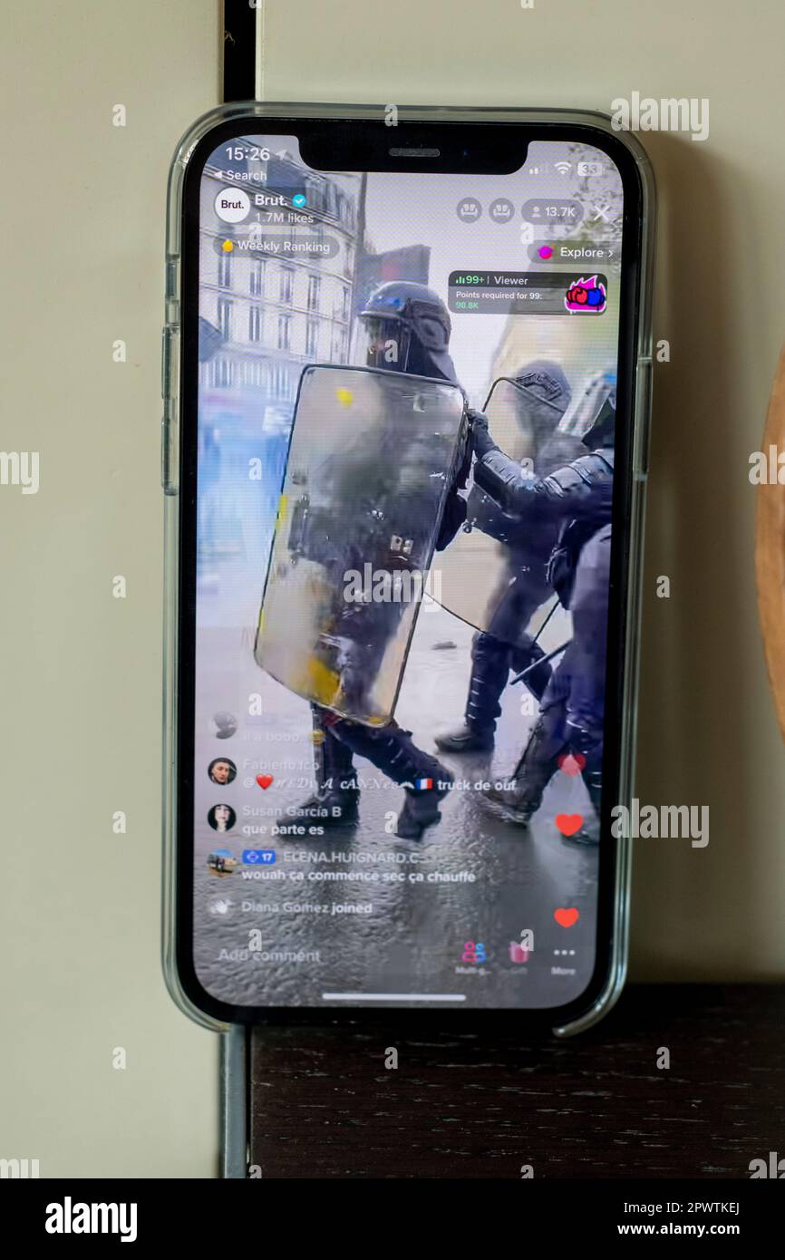 Pictures of an iphone12 live streaming the riots in Paris on the 1st of May 2023, anti-macron Stock Photo