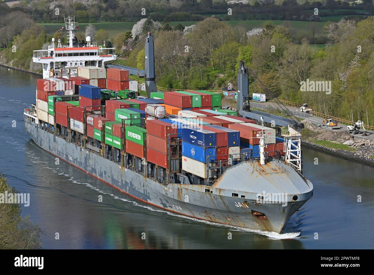 Containership JAN passing the Kiel Canal Stock Photo
