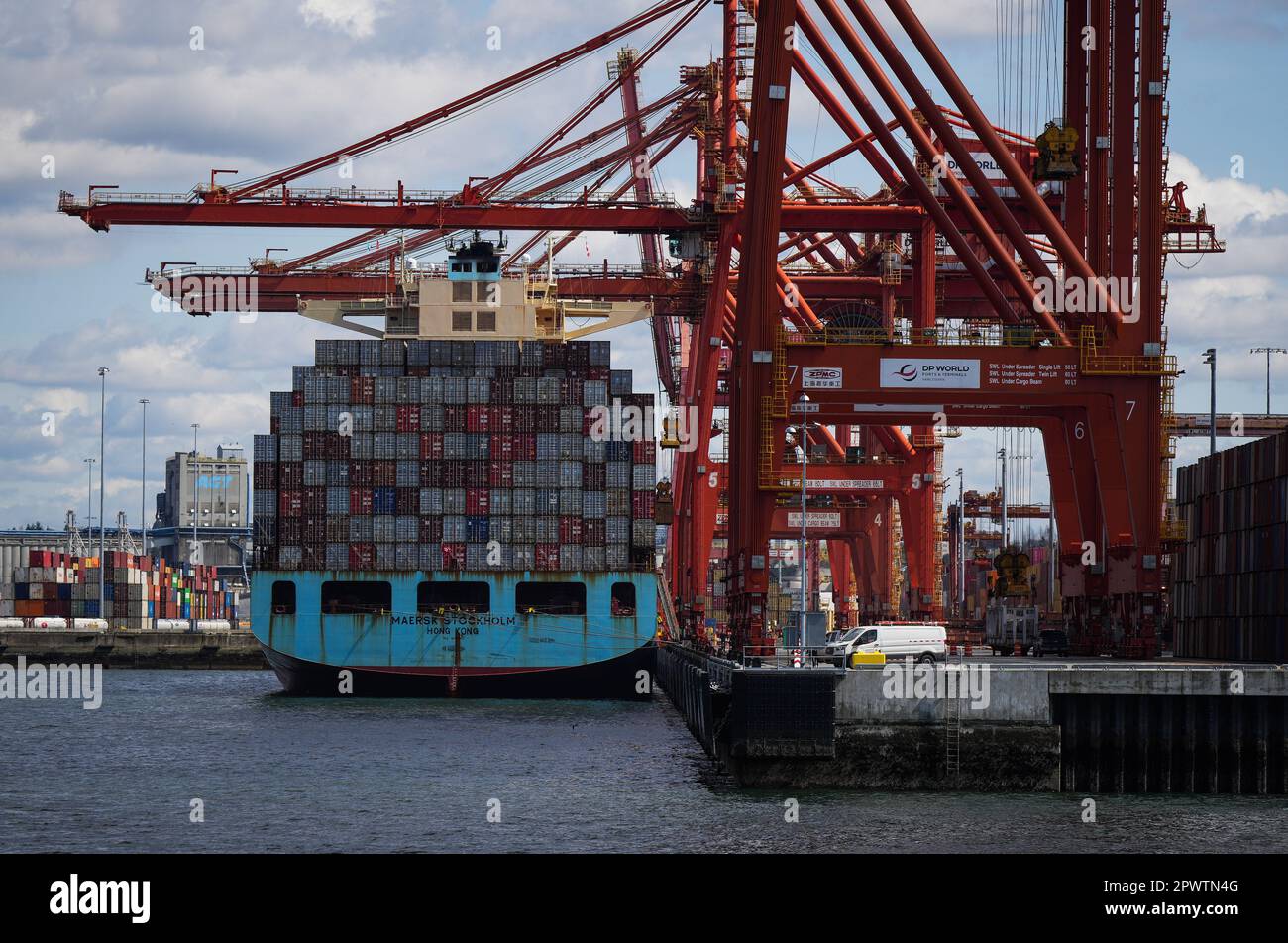 Vancouver, Canada. 25th Apr, 2023. Cargo containers are unloaded from the  Maersk Stockholm ship with gantry cranes while docked at port, in  Vancouver, on Tuesday, April 25, 2023. The Vancouver Fraser Port