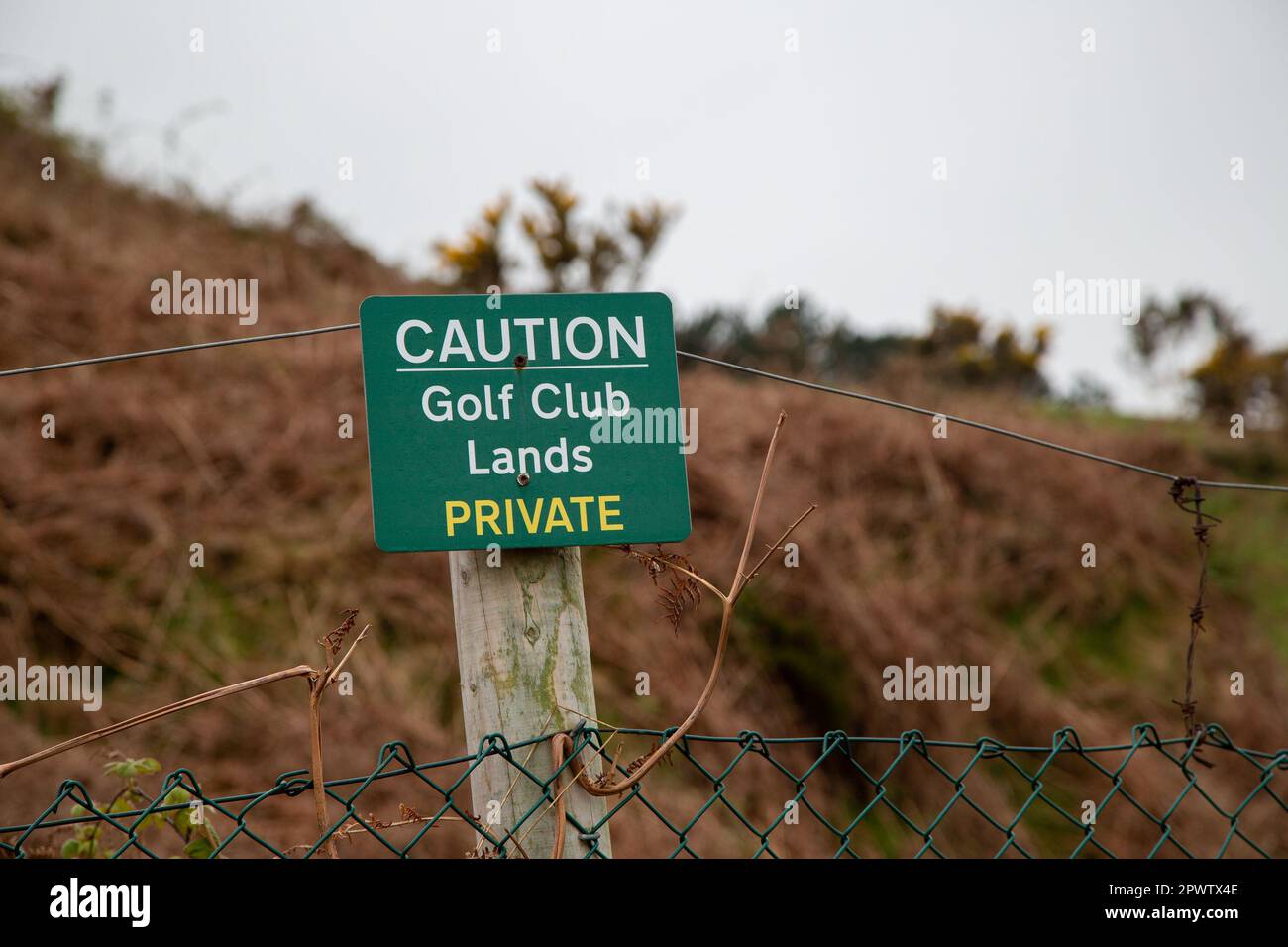 Caution Golf Club Lands, Private sign on fence Stock Photo