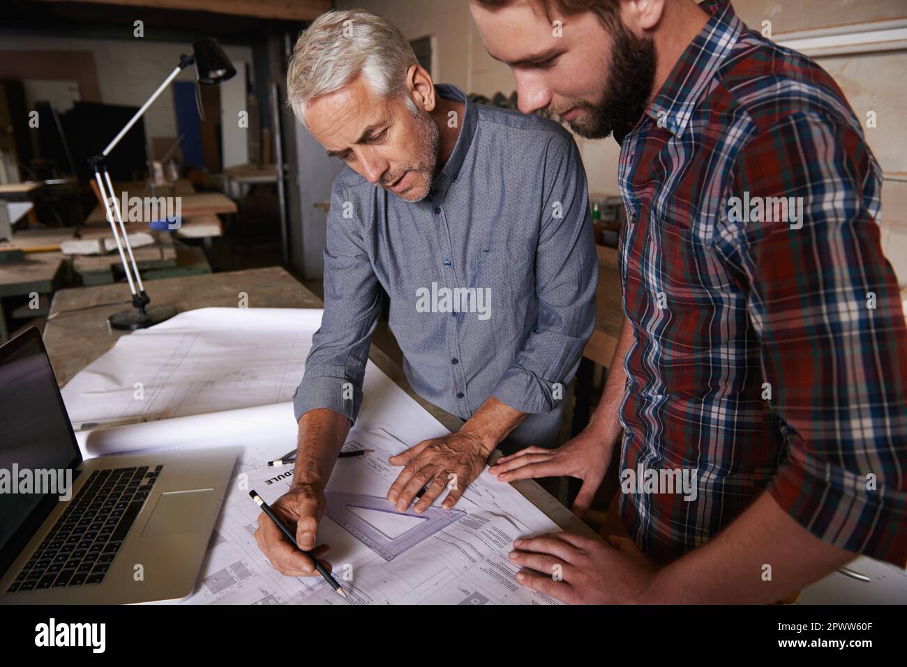 Turning his vision into reality. An architect drawing up plans Stock