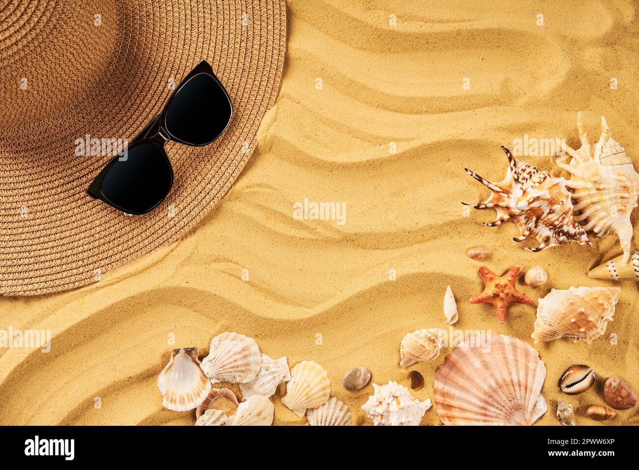 Summer time vacation concept. Straw hat, sunglasses and seashells on ...