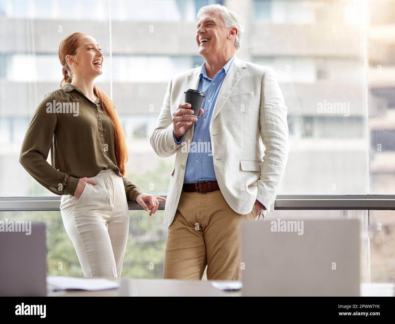 Rapport creates a strong team. two businesspeople standing together and ...