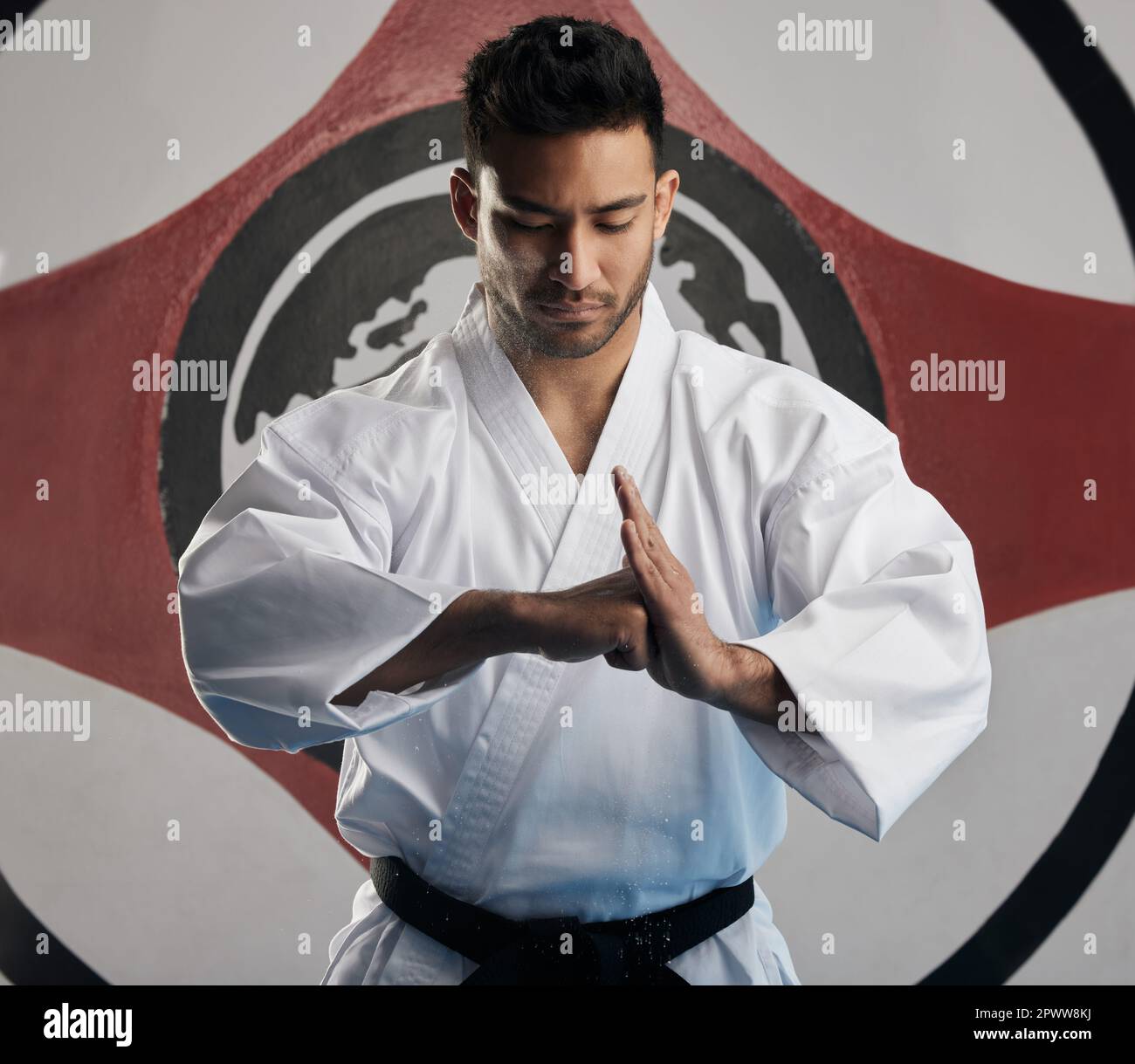 Showing respect to his opponent. a handsome young martial artist