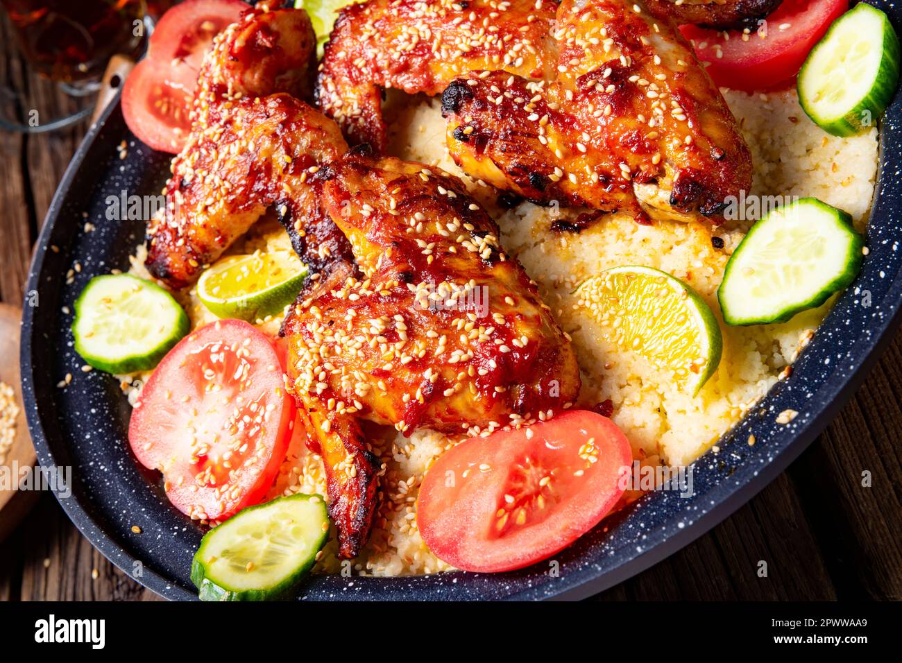 couscous with fried chicken wings spicy Stock Photo Alamy