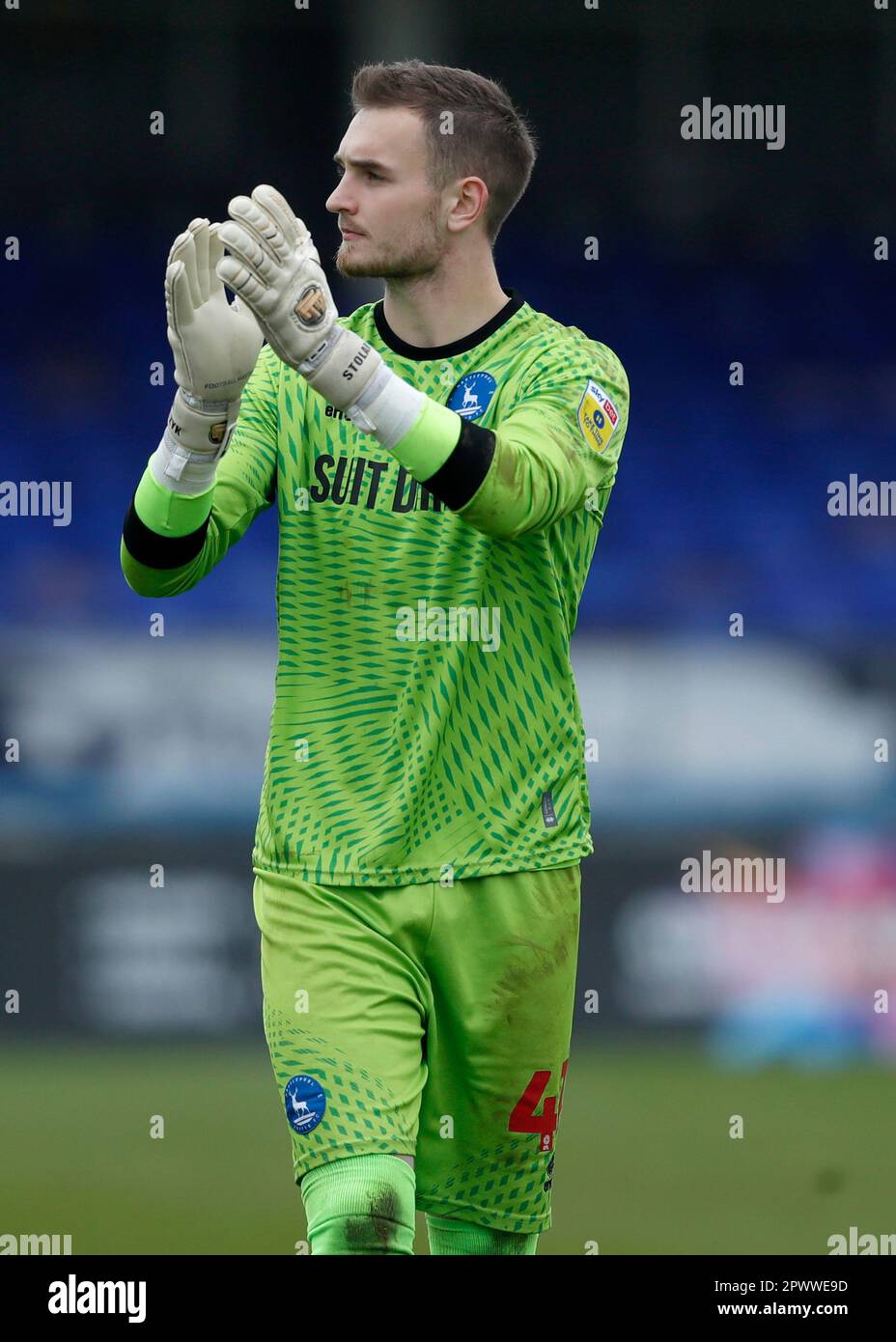 Hartlepool United goalkeeper Jakub Stolarczyk applauds supporters