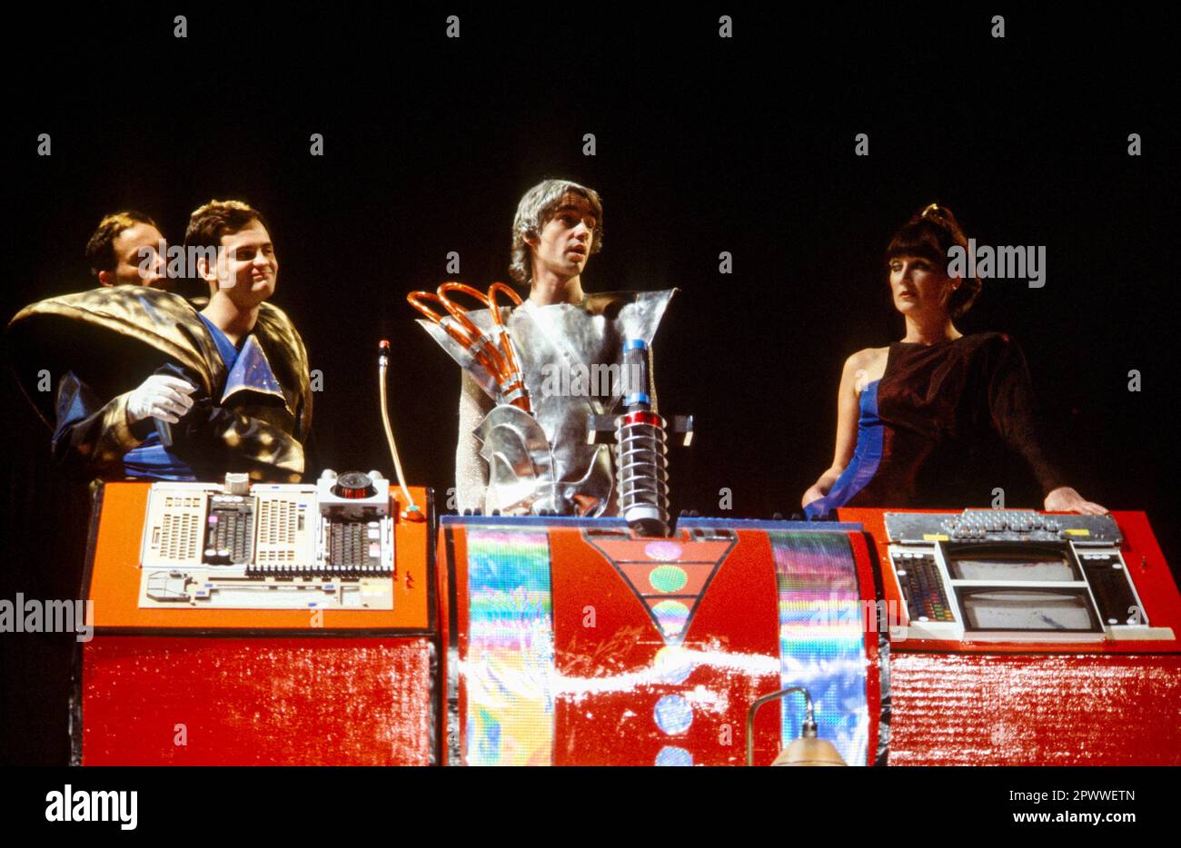 l-r: Nicolas D'Avirro & John Terence (Zaphod Beeblebrox), David Learner (Marvin), Jude Alderson (Trillian) in THE HITCHHIKER'S GUIDE TO THE GALAXY by Douglas Adams at the Rainbow Theatre, Finsbury Park, London  15/07/1980  set design: Richard Dunkley  scenic design: Mitch Davies  costumes: Barbara Tyrell  lighting: Martin Richman  director: Ken Campbell Stock Photo