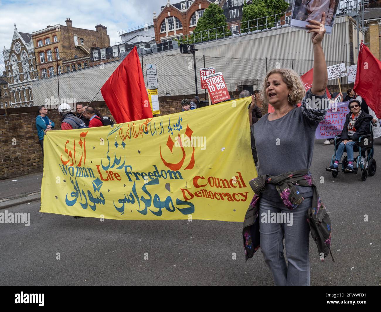 London, UK. 1 May 2023. Woman, Life, Freedom banner for Iran. Several ...