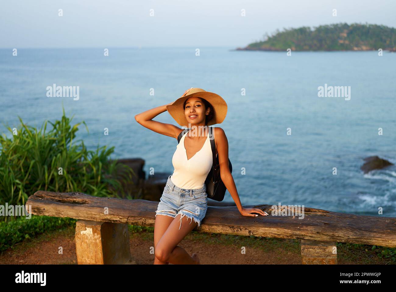 Girl on shore in straw hat hi-res stock photography and images - Alamy