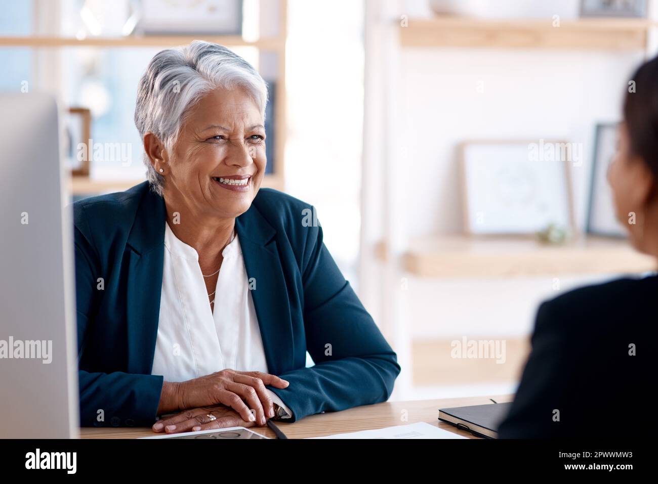 Compassionate leaders listen well to what others have to say. a mature businesswoman having a meeting with a colleague in an office Stock Photo