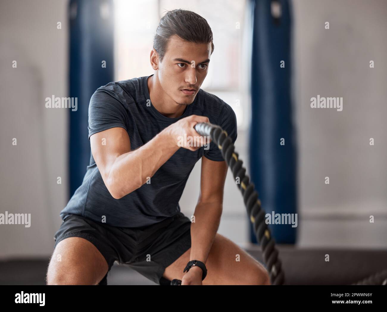 Fitness, man and rope exercise, sports training and workout for muscle ...