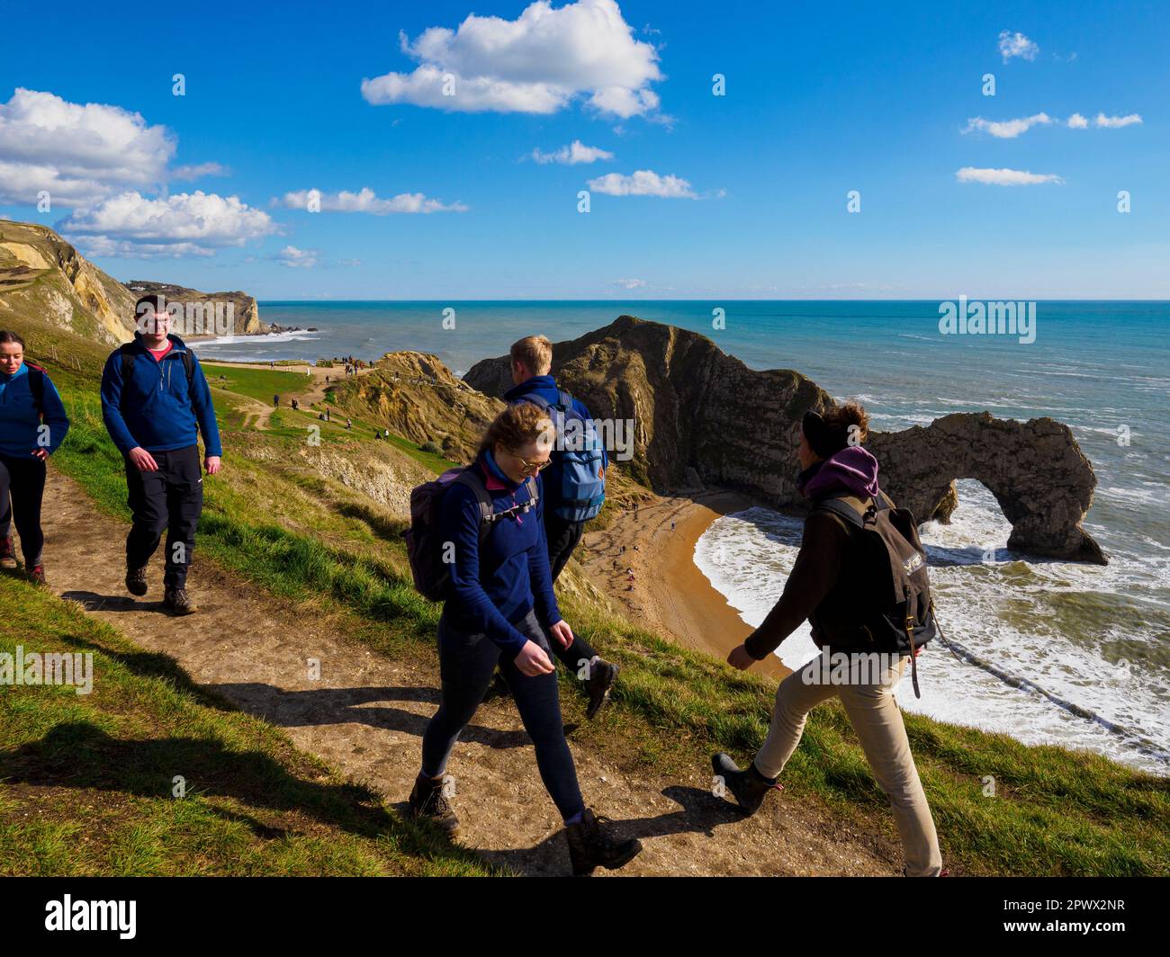 Peolpe walking on the South west coast path at Durdle Door, Dorset, UK Stock Photo