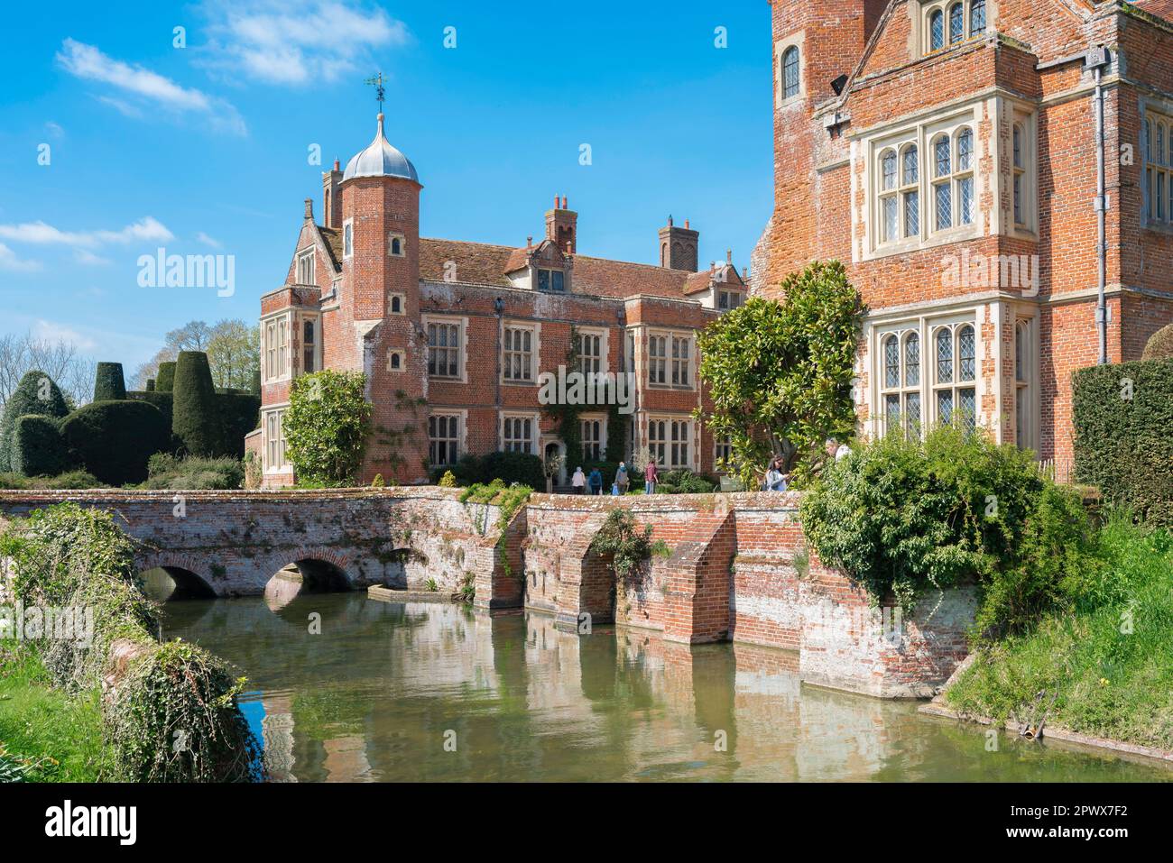 Stately home England, view in summer of the moat and south facing facade of Kentwell Hall, a mid 16th century country house in Suffolk, England Stock Photo