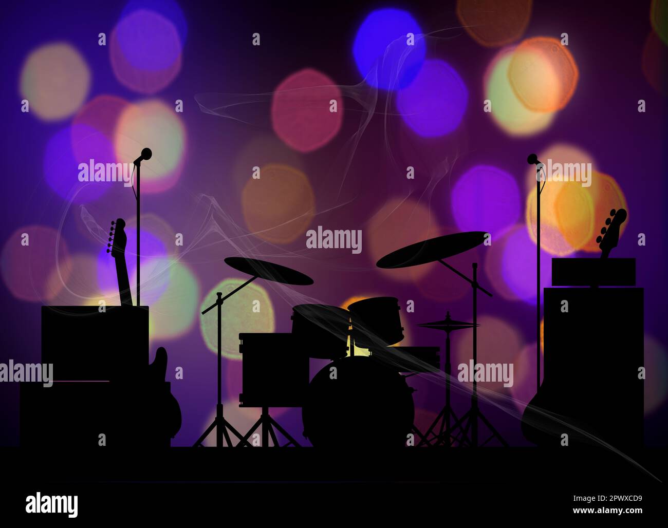 Silhouette of a rock bands equipment on stage lit with brightly colored
