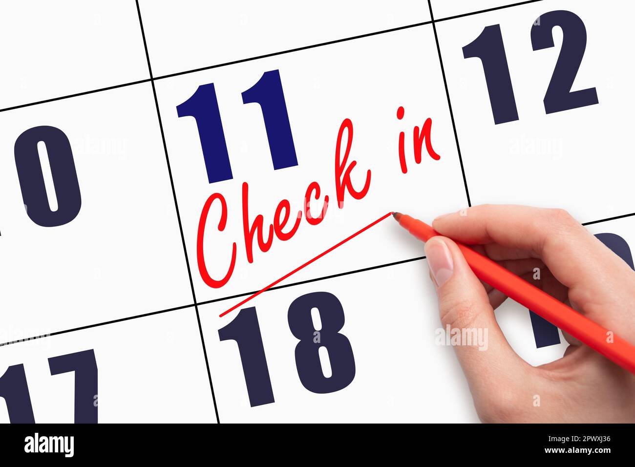 11th day of the month.  Hand writing CHECK IN and drawing a line on calendar date. Business.  Day of the year concept. Stock Photo