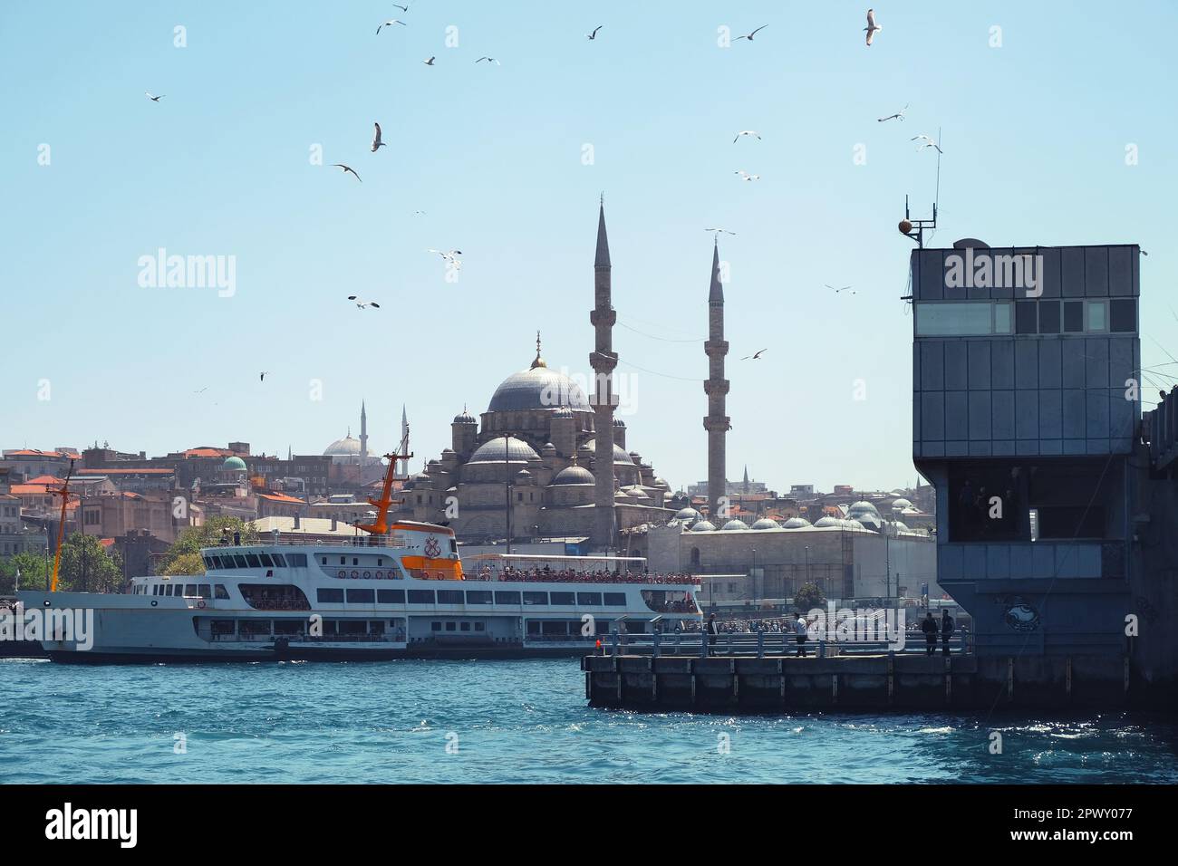 Istanbul, Turkey - May, 2022. Ferry boat on sea with the Blue Mosque and buildings in the Galata Bridge area at Istanbul, Turkey Stock Photo