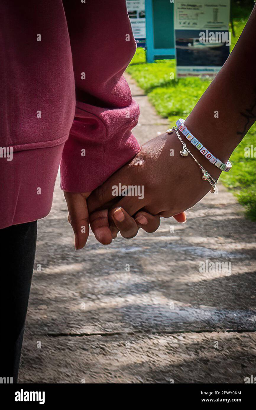 Close up of the hands of dark-skinned women. Concept love, romance, friendship, colour, enjoyment, togetherness, company. Stock Photo