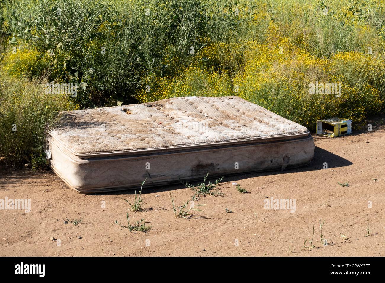 Illegal trash dumping along a rural roadside Stock Photo - Alamy
