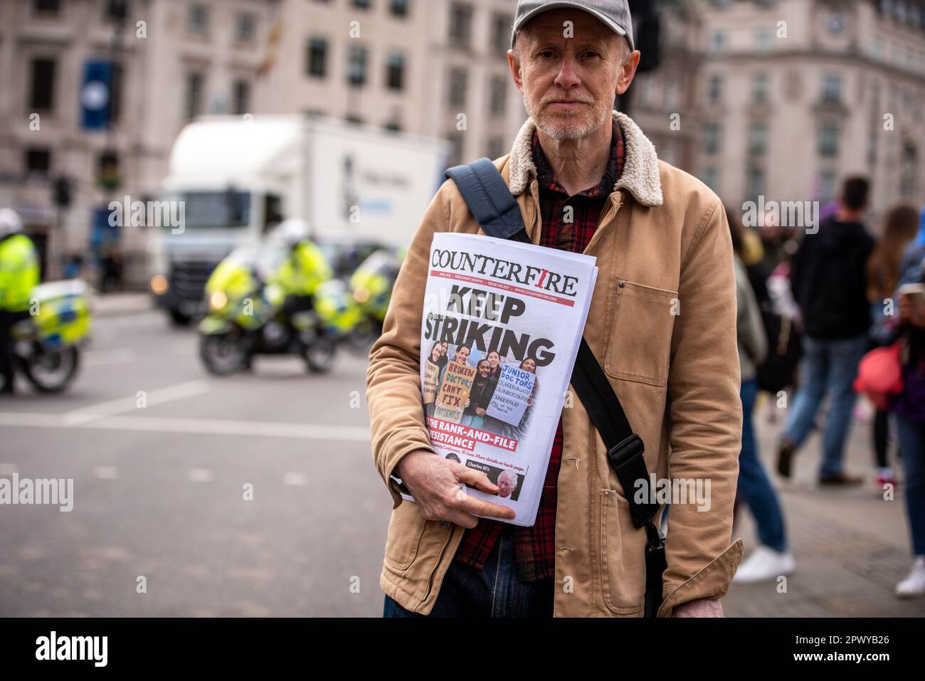 London, UK. 01st May, 2023. An activist poses with a newspaper during the London May Day Rally and March. London May Day Organising Committee fight for proper pay and working conditions, save jobs and services and scrap anti-union laws. Credit: SOPA Images Limited/Alamy Live News Stock Photo
