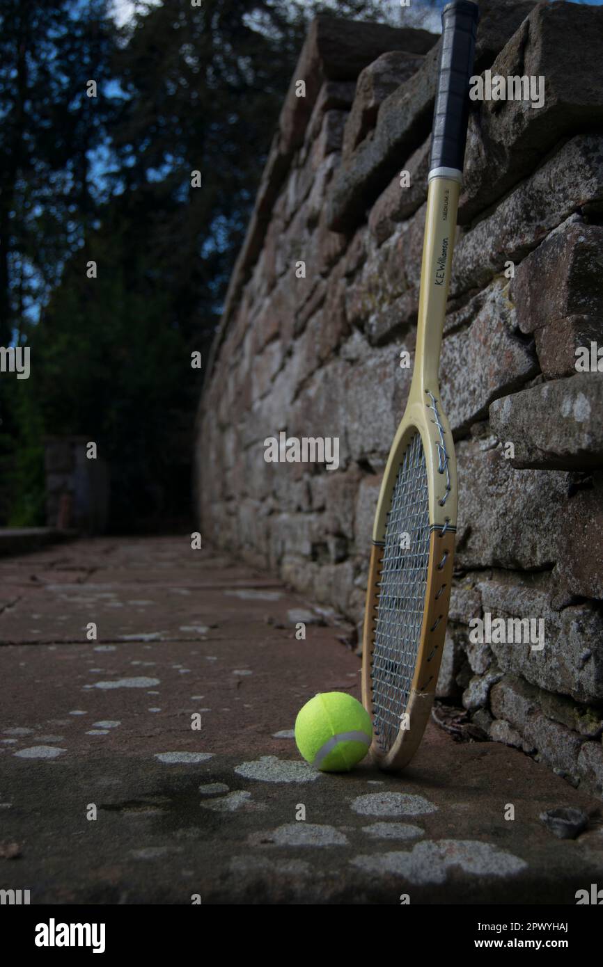 Tennis Racket Path Three tennis balls and vintage racket on the path Stock Photo - Alamy