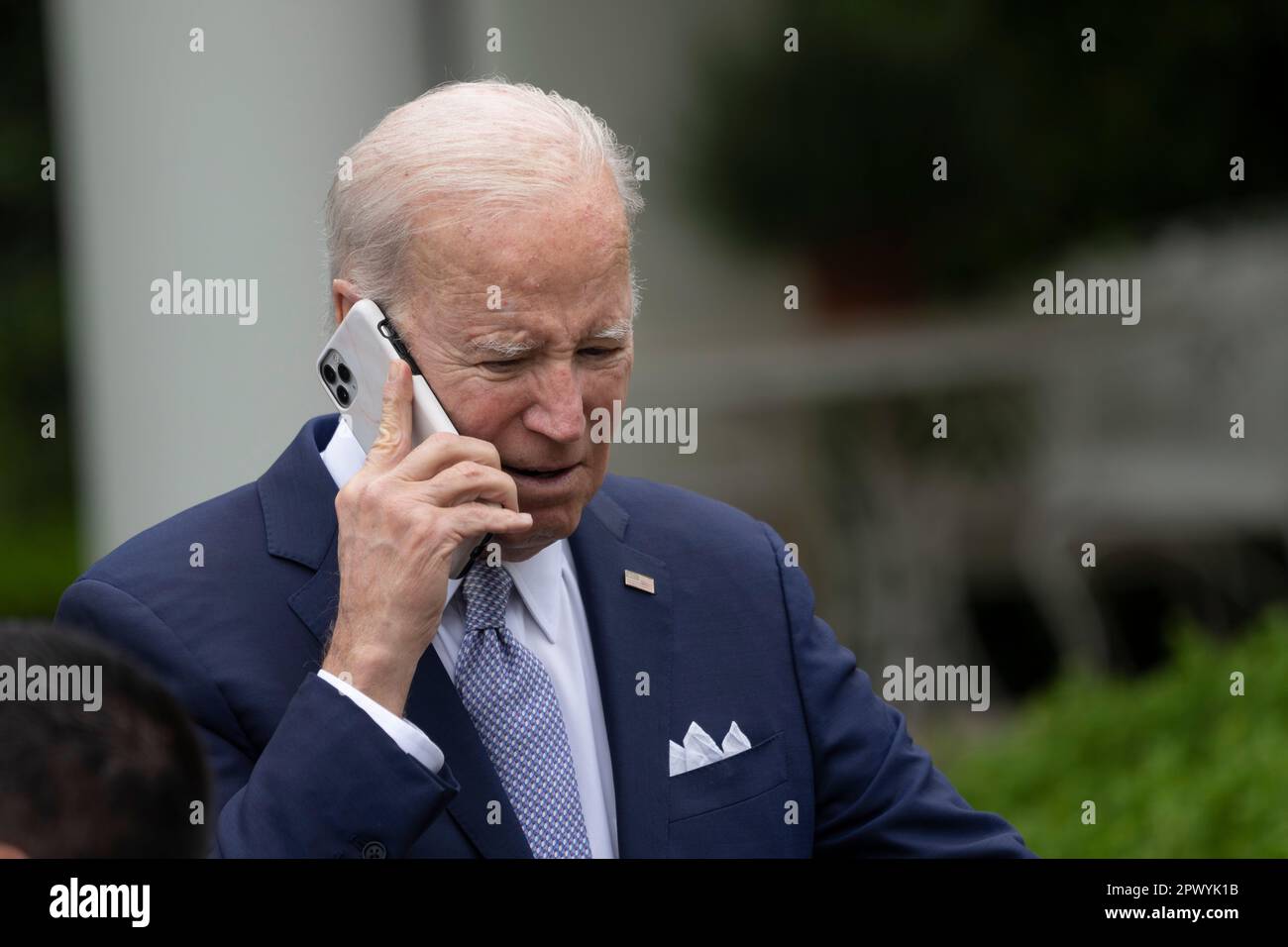 United States President Joe Biden takes a phone call after making