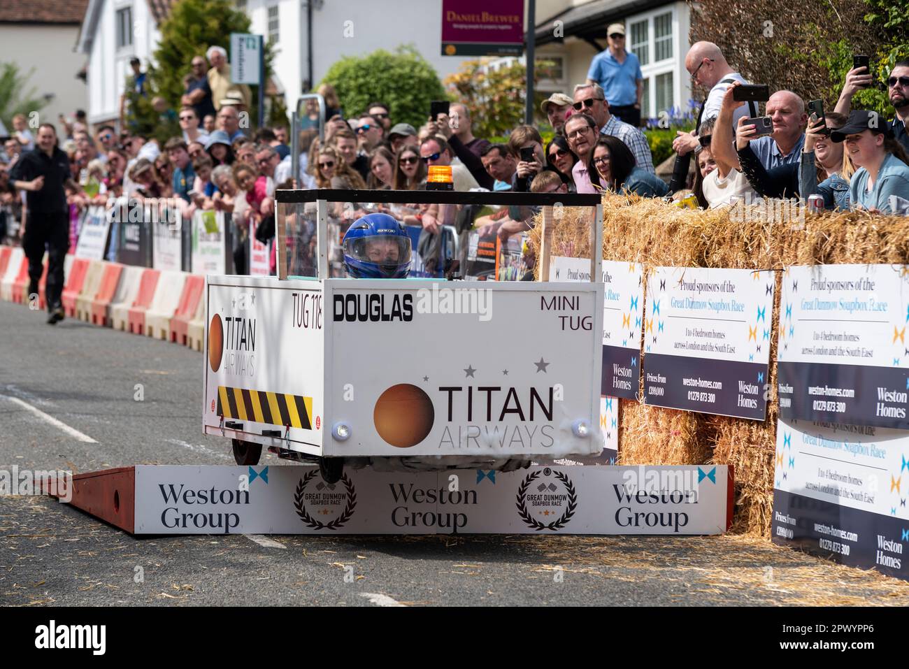 Titan Engineering team cart competing in the Great Dunmow soapbox race 2023, Essex, UK. Taking the jump ramp. Aircraft tug shaped cart Stock Photo
