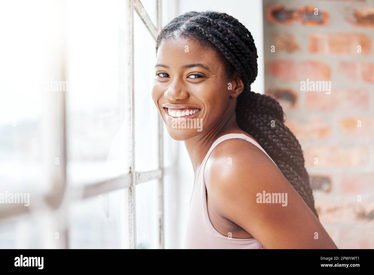 Face portrait black woman and smile in gym by window after