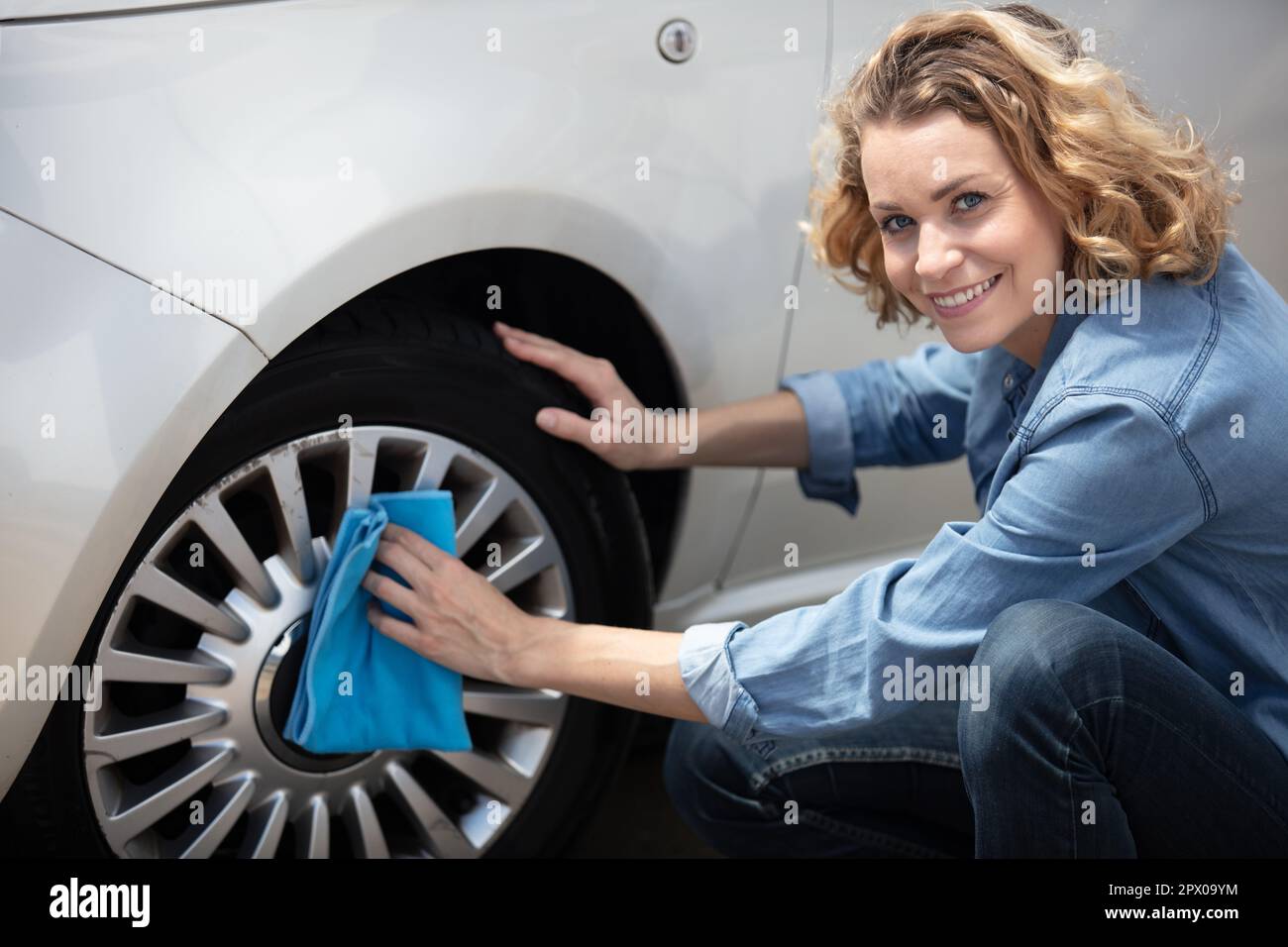 woman washing cars with cloth Stock Photo Alamy