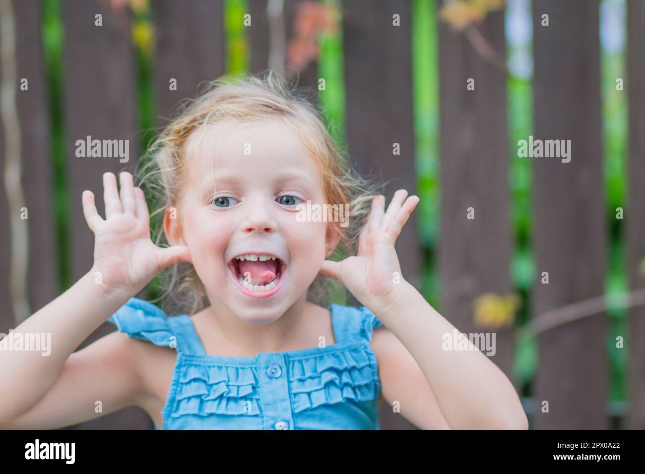 Sweet little girl, two years old. The girl smiles, looks into the