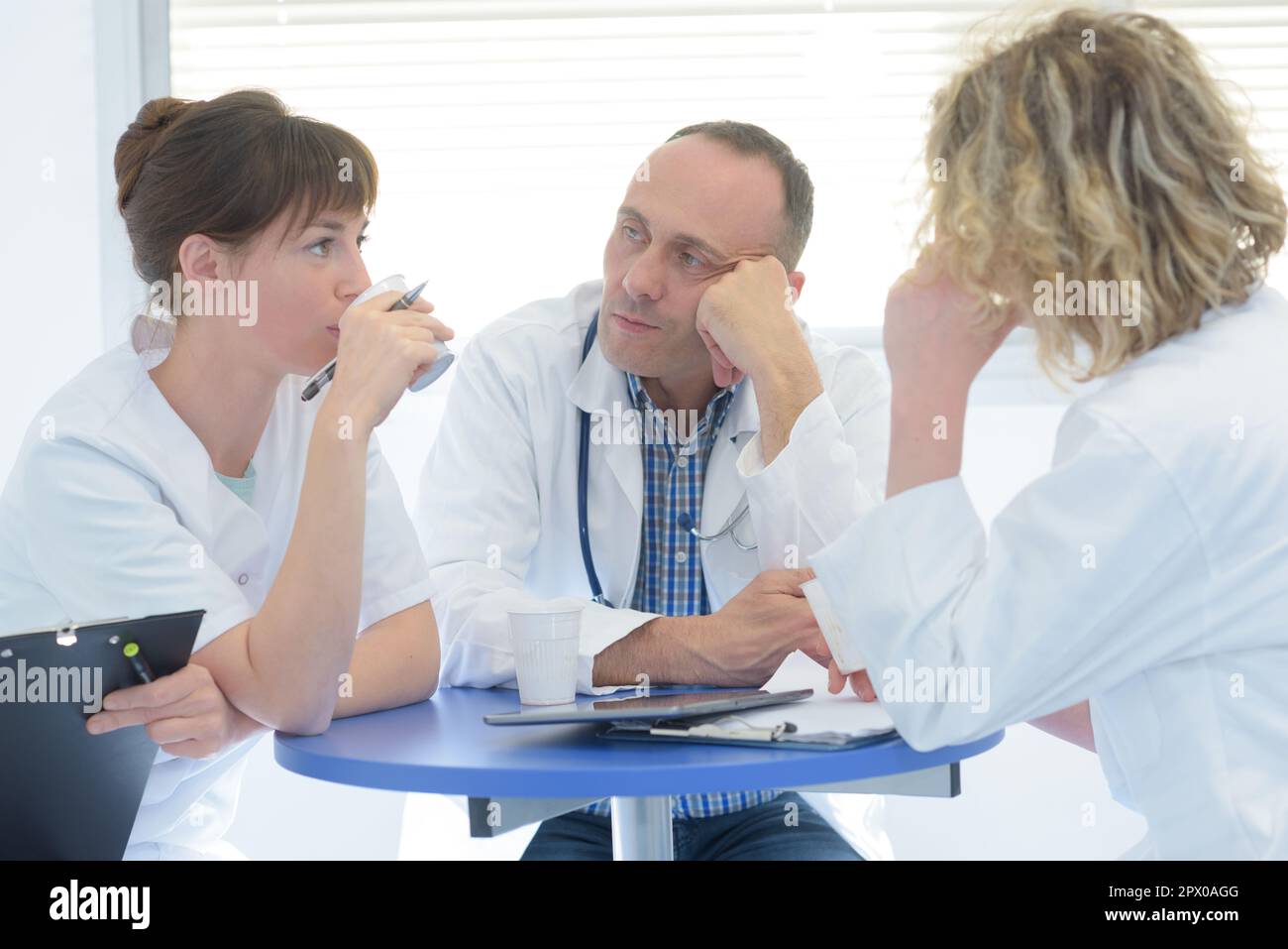 medical staff chatting in modern hospital canteen Stock Photo - Alamy