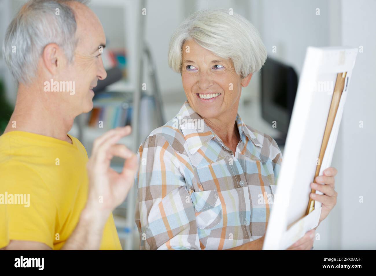 happy senior couple doing diy Stock Photo