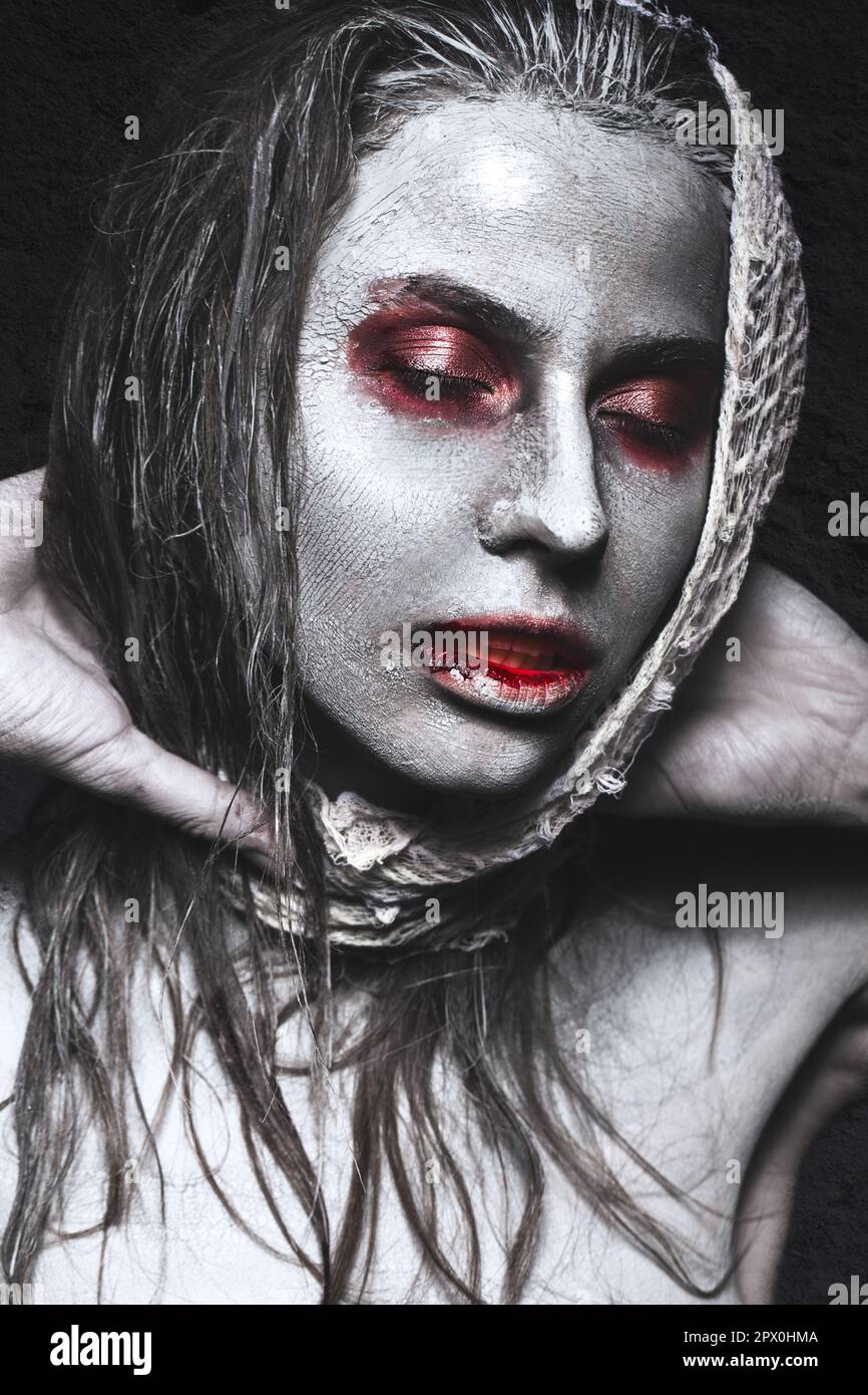 Girl in the form of zombies, Halloween corpse with blood on his lips