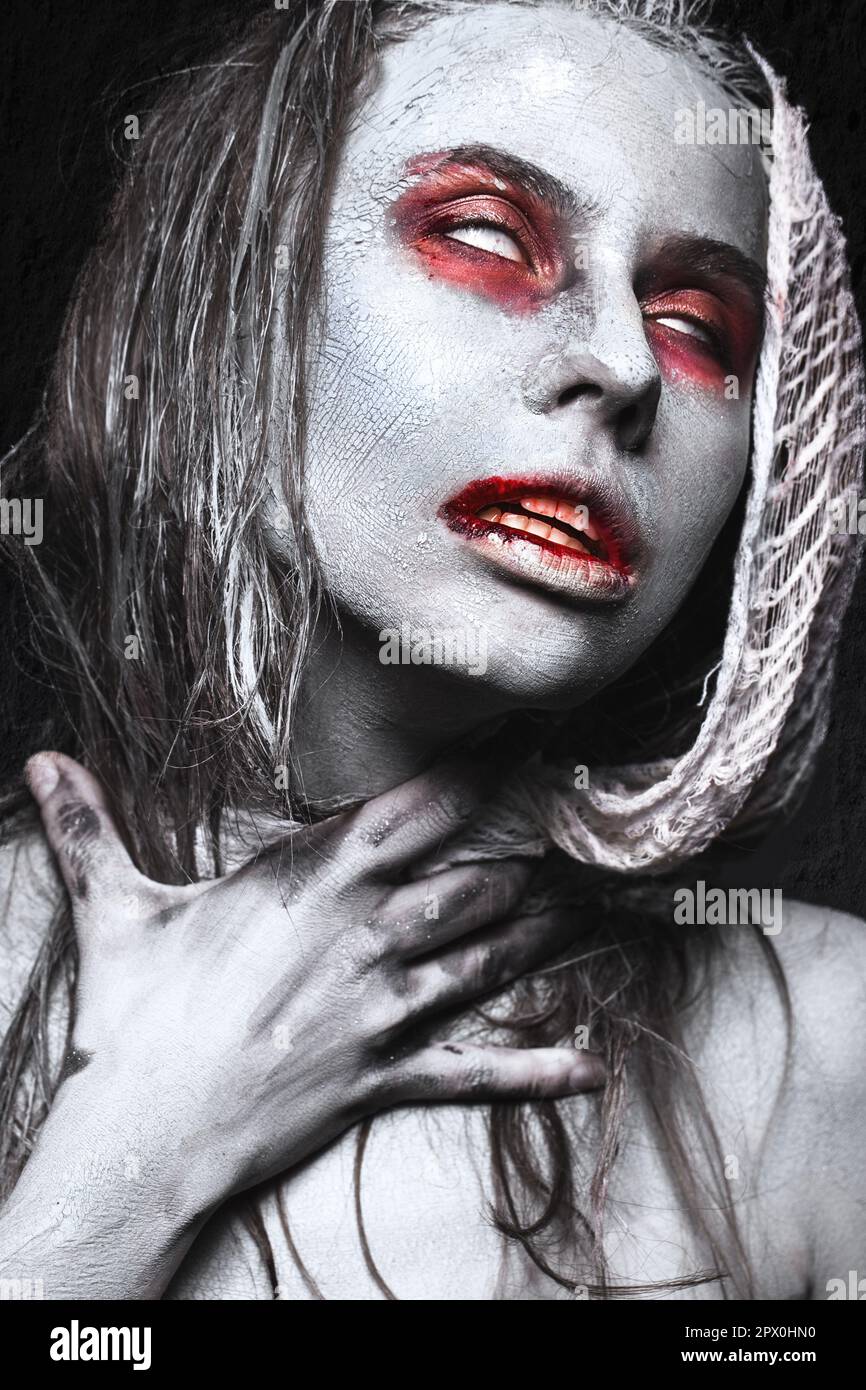 Girl in the form of zombies, Halloween corpse with blood on his lips