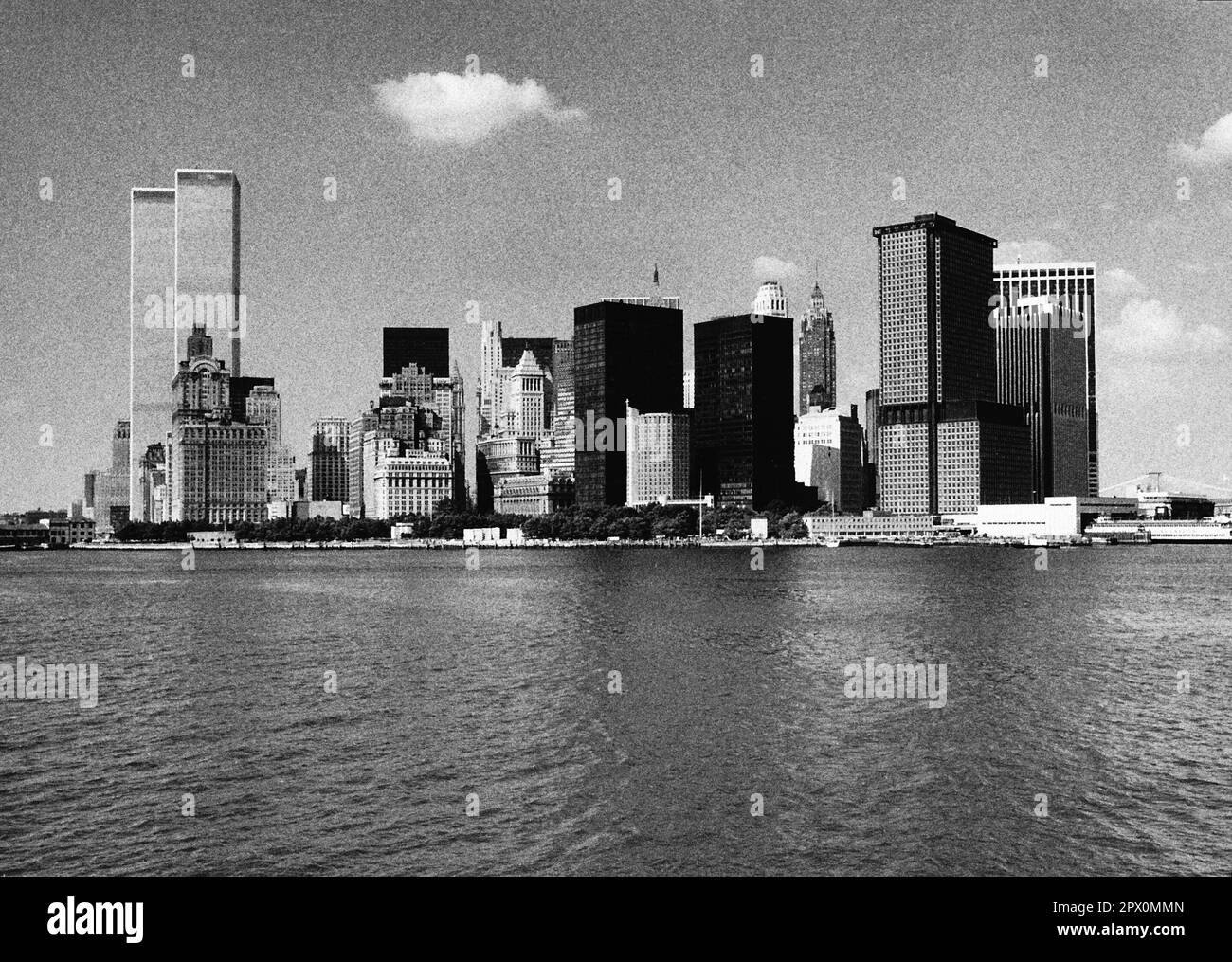 AJAXNETPHOTO. JULY, 1975. NEW YORK, USA. - ICONIC LOWER MANHATTAN SKYLINE - SEEN FROM SEAWARD; TWIN WORLD TRADE CENTRE TOWERS AT LEFT. PHOTO:JONATHAN EASTLAND/AJAXREF:232404 111 Stock Photo