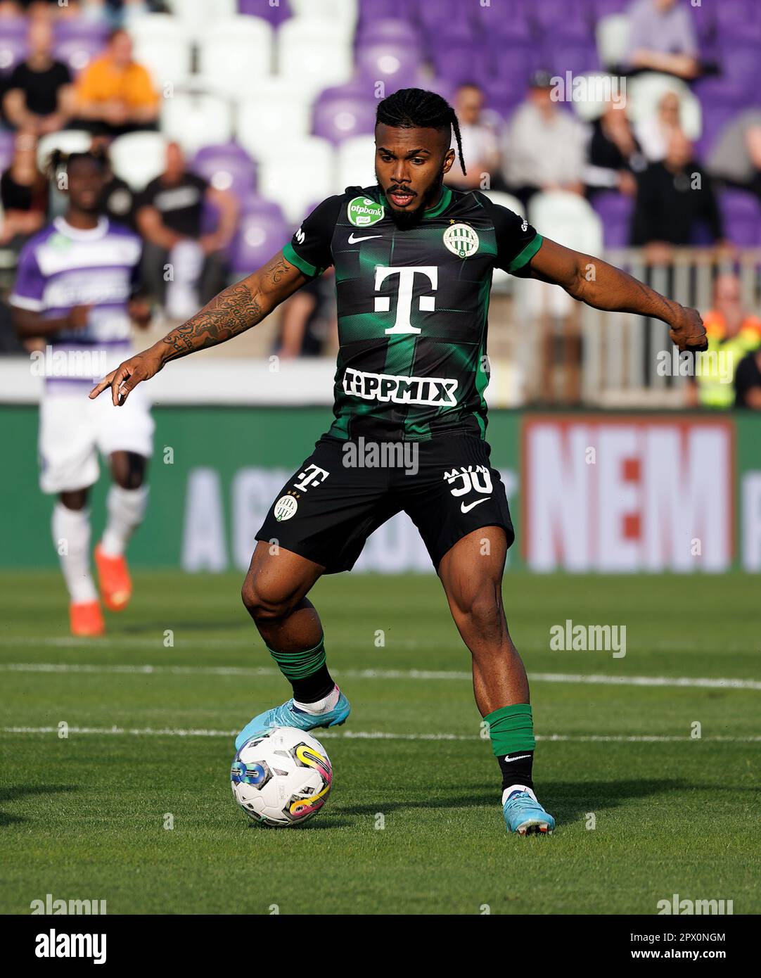 Amer Gojak of Ferencvarosi TC tries to control the ball in front