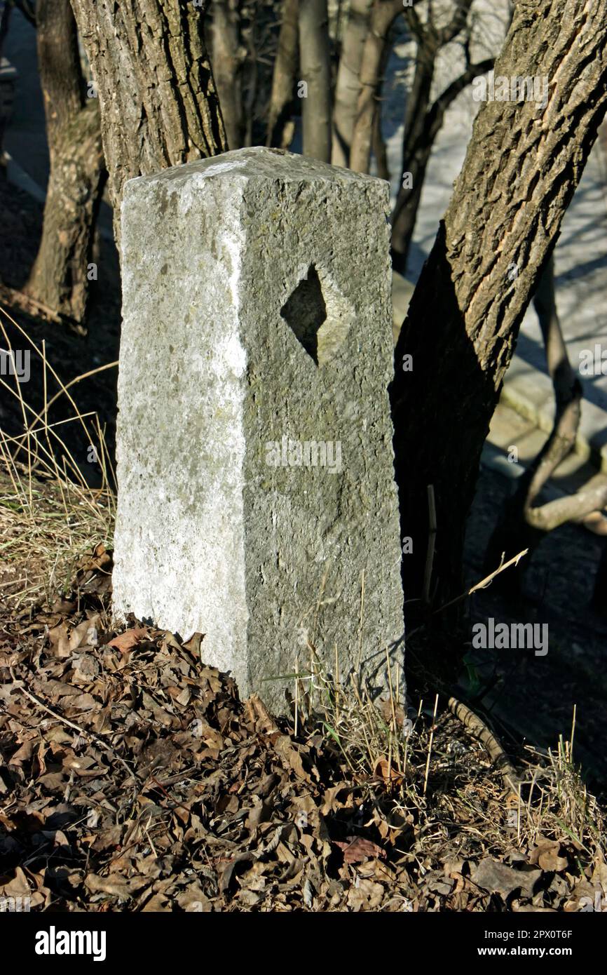 Old Sign Using Stone Old stone sign by the road Stock Photo - Alamy