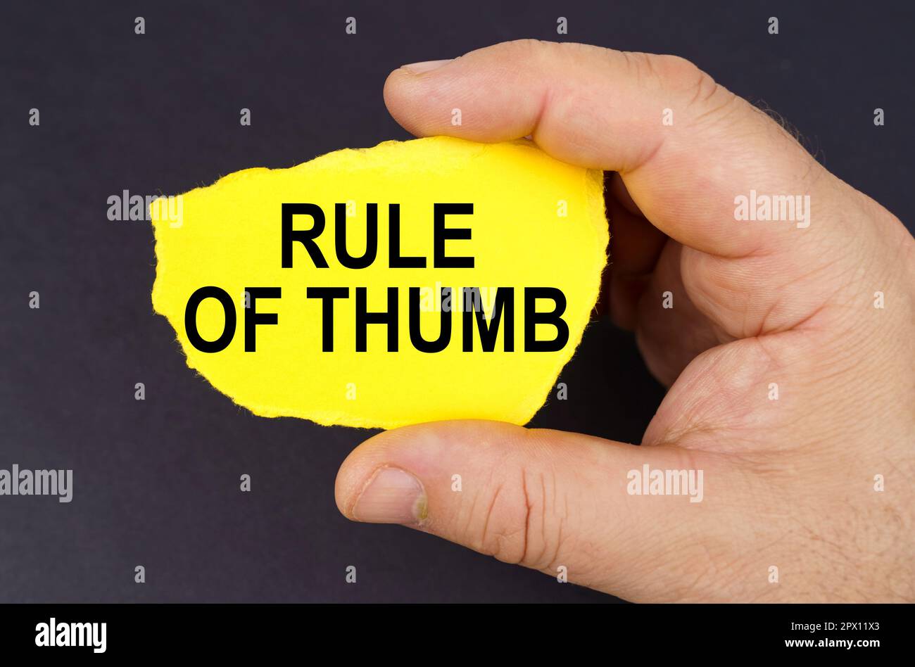 Business concept. On a black background, in the hands of a man, a