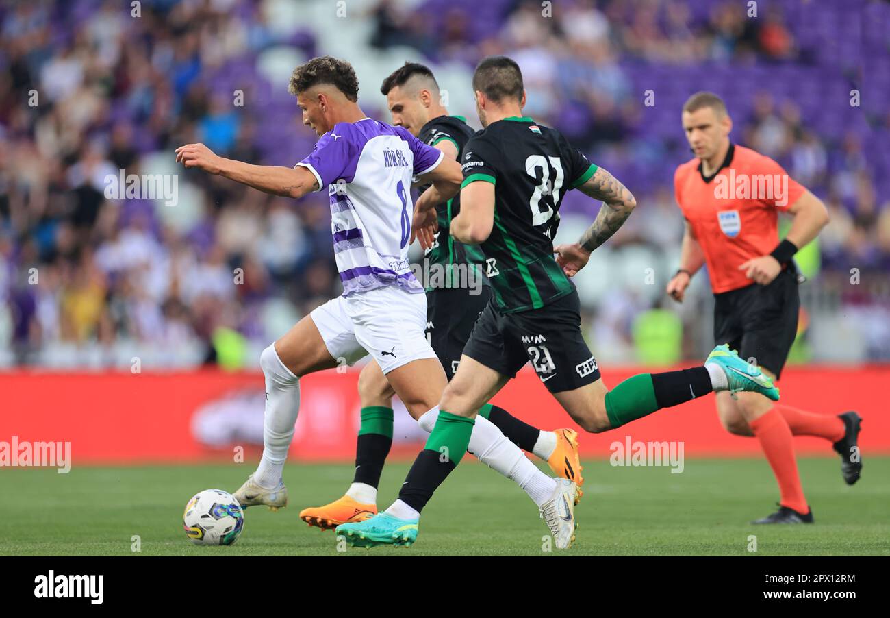 Matija Ljujic of Ujpest FC fights for the possession with Amer