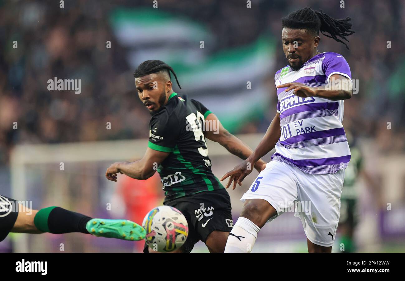 Petrus Boumal of Ujpest FC competes for the ball with Jose Marcos