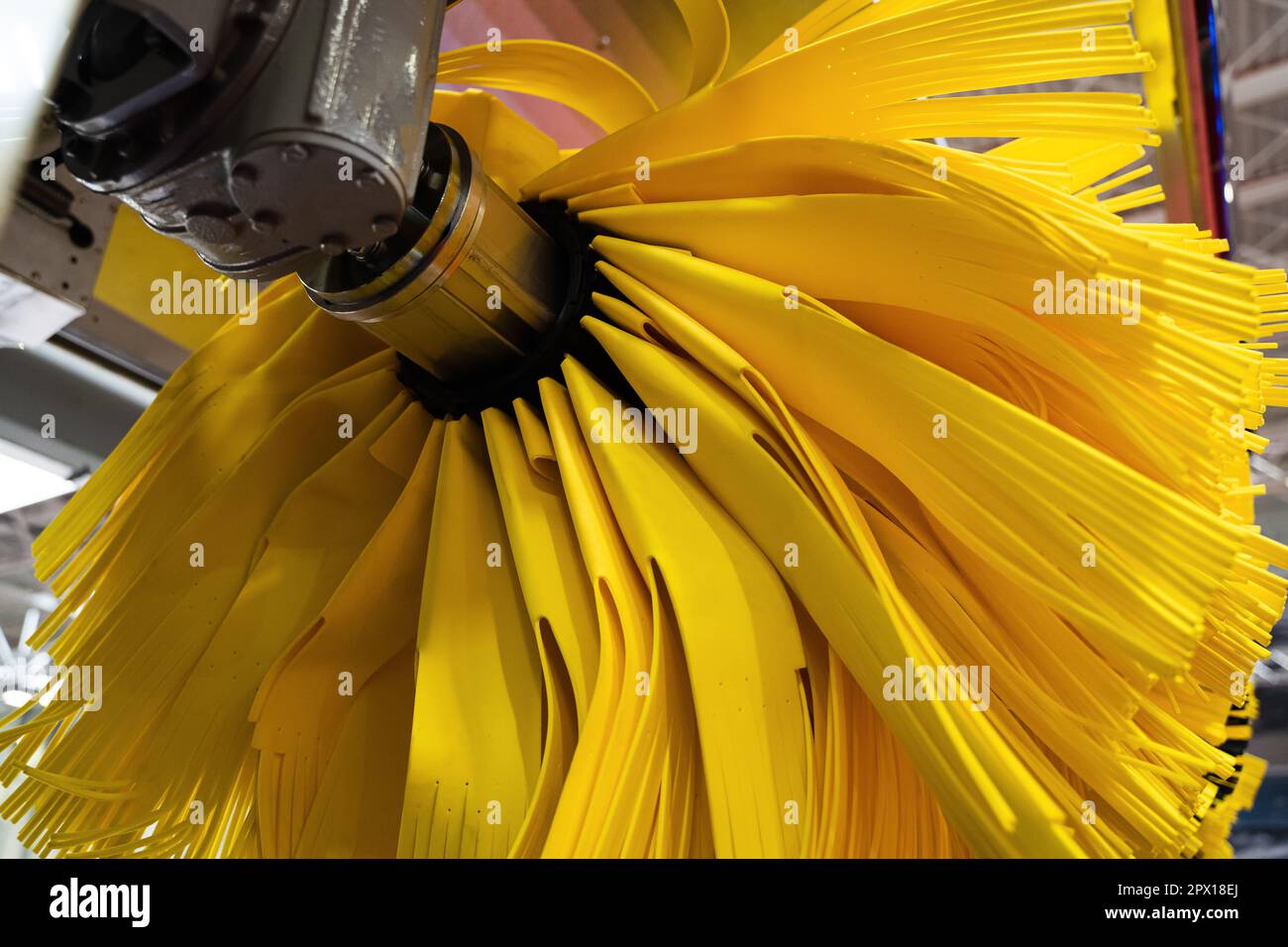 front view closeup detail of black and yellow automatic car wash system