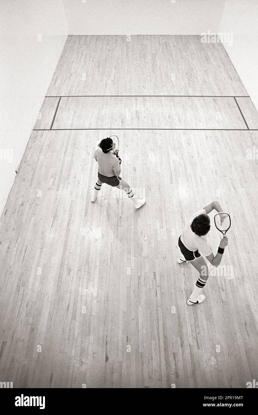 1970s TWO MEN PLAYING RACQUET BALL VIEW FROM ABOVE THE COURT s21526