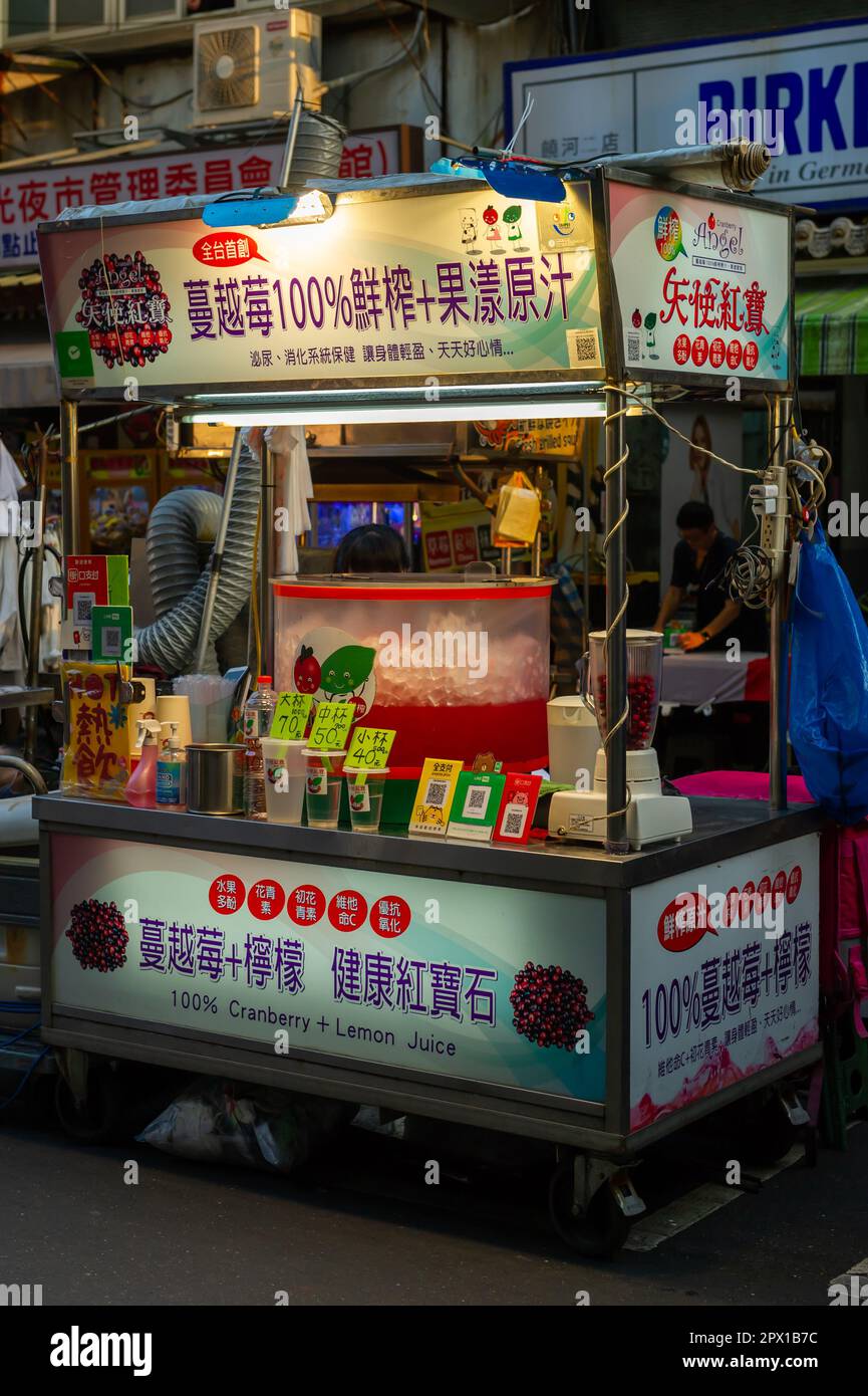 Selling street food at the Raohe Street Night Market, Taipei, Taiwan