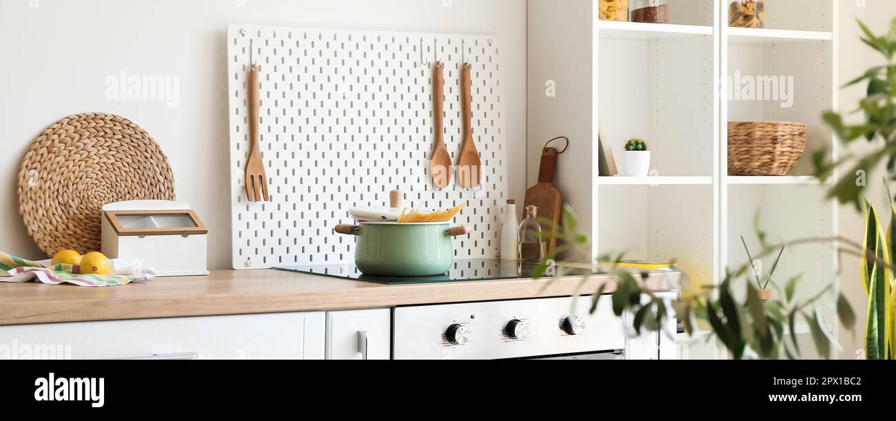 Light kitchen interior with modern furniture and pegboard Stock Photo ...