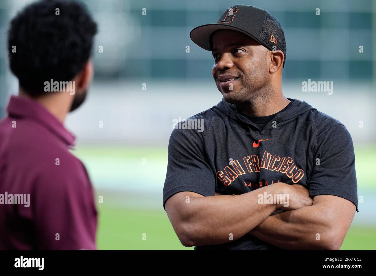 San Francisco Giants first base coach Antoan Richardson talks with fans