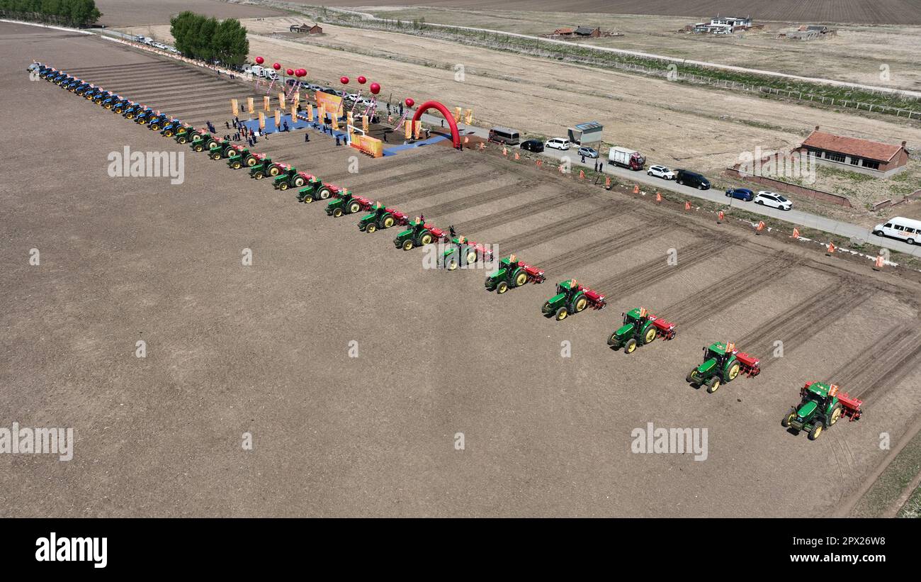 SHENYANG, CHINA - MAY 1, 2023 - Aerial photo taken on May 1, 2023 shows multiple seeders sowing spring ploughing at a planting base in Shenyang, Liaon Stock Photo